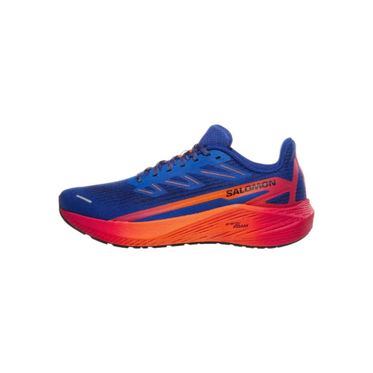 Blue and red running shoe in side view with orange midsole and visible SALOMON branding