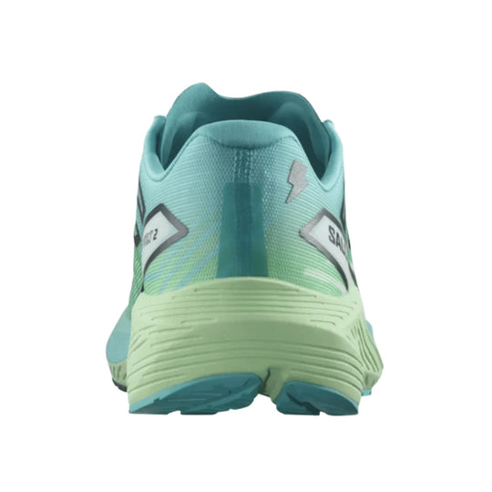 Teal and mint running shoe viewed from the heel, with a textured upper and thick cushioned sole.