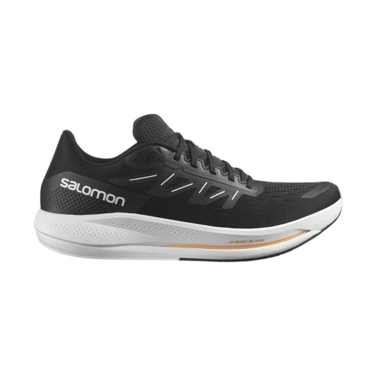 Black running shoe with white midsole and orange accent, shown in side profile