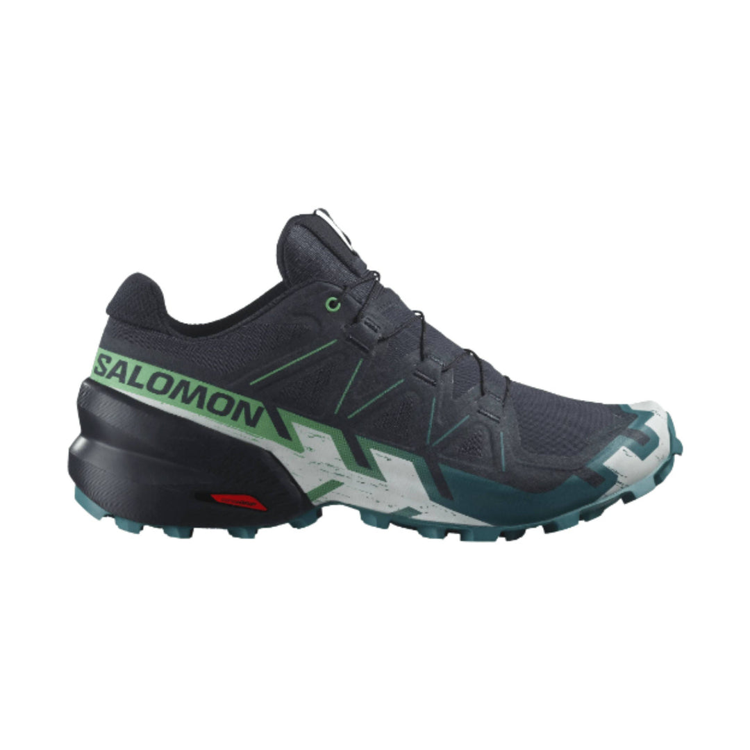 Black trail running shoe with green side branding and teal outsole accents