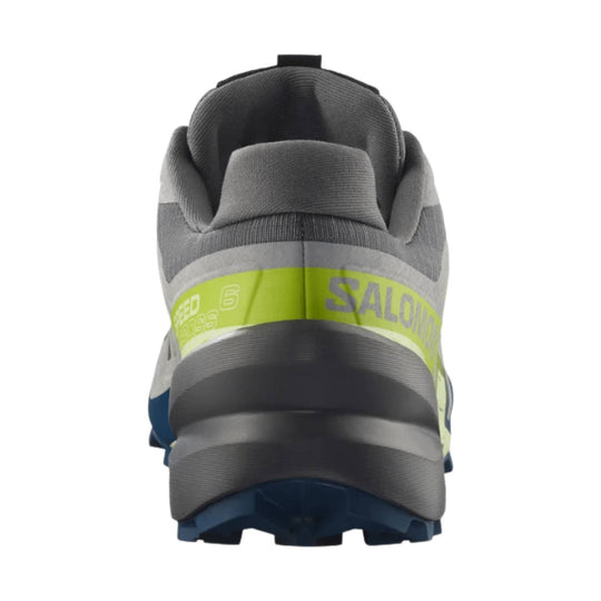 Gray trail running shoe with lime band, rear view