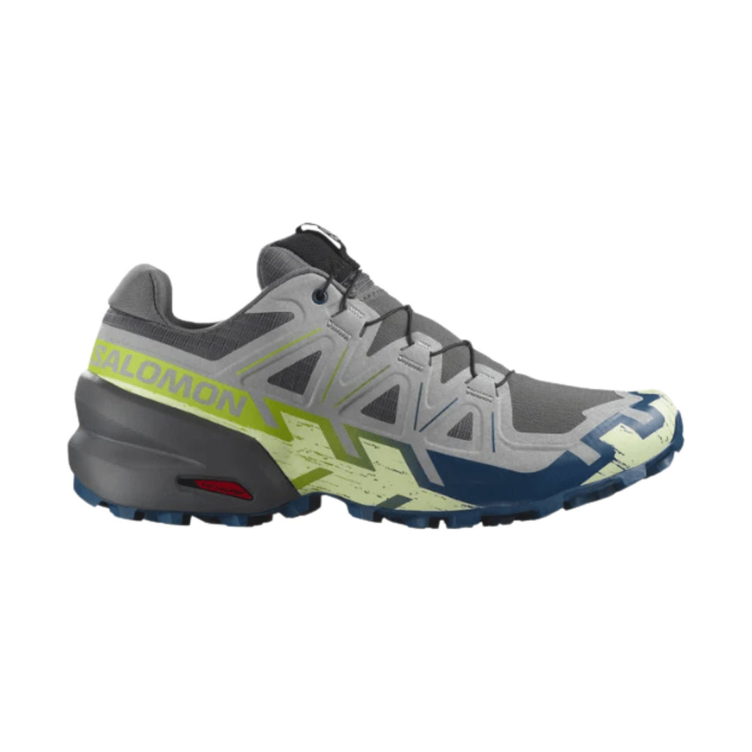 Gray trail running shoe with blue and lime accents and bold side branding, shown in profile
