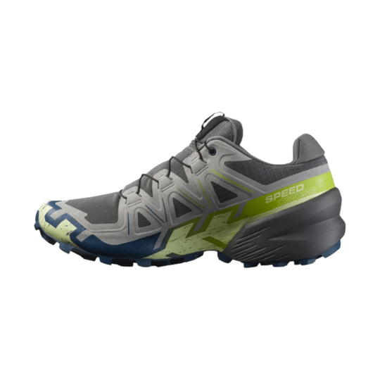 Gray trail running shoe with black laces, neon yellow side panel, and blue toe accent