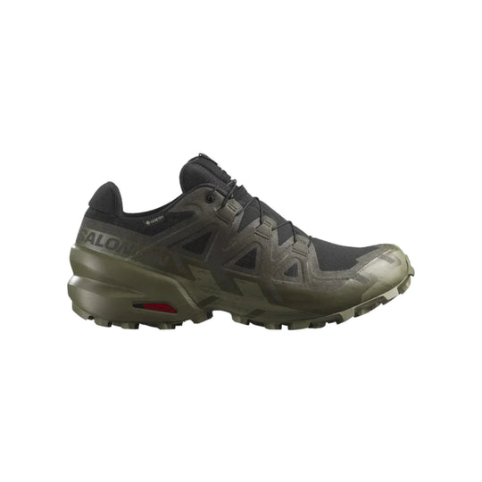 Low-top black and olive hiking shoe with lugged sole and visible Salomon branding