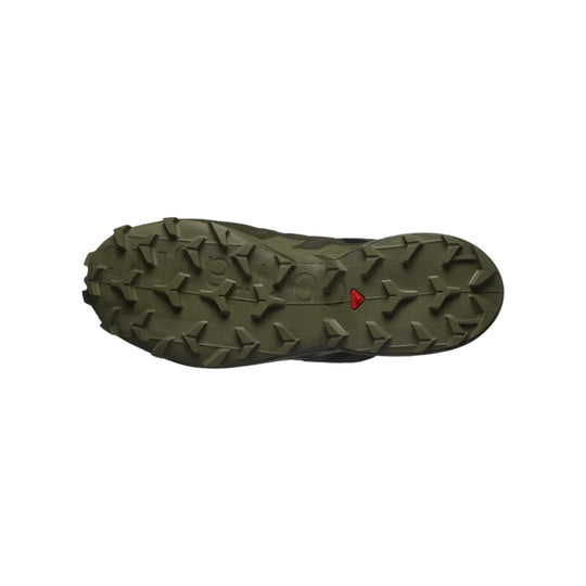 Olive hiking shoe outsole with deep traction lugs and a small red triangular logo