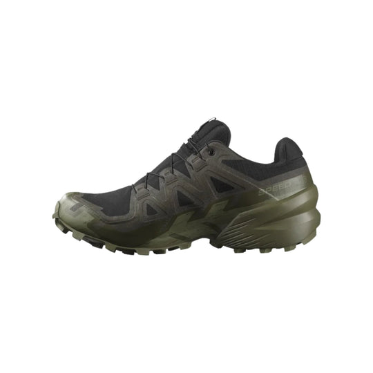 Black low-cut trail hiking shoe with olive sole and aggressive tread, shown in side view
