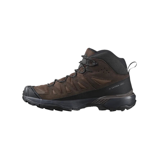 Brown and black mid-height hiking boot with rugged tread and side pull tab