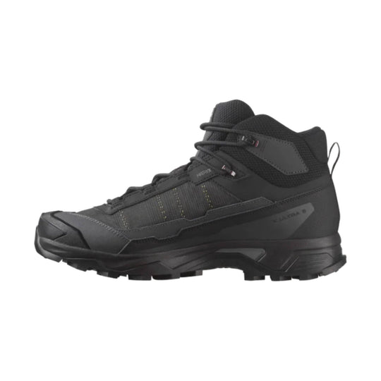 Black mid-height hiking boot with lugged sole and lace-up closure, side view