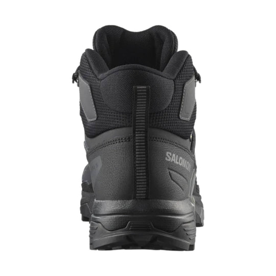 Black mid-height hiking boot shown from the back with textured mesh upper and rear pull tab