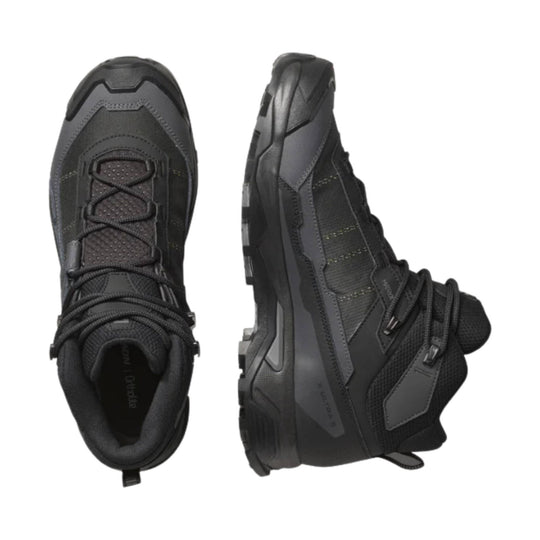 Black mid-height hiking boots with thick lugged soles, lace-up fronts, and side ankle support