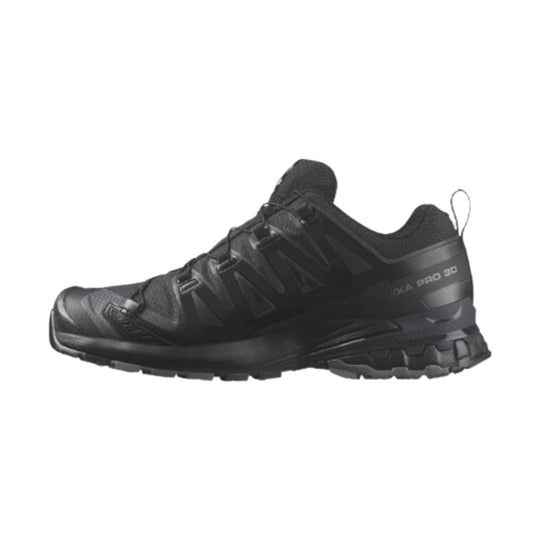 Black low-cut trail running shoe with lugged sole, mesh upper, and side branding
