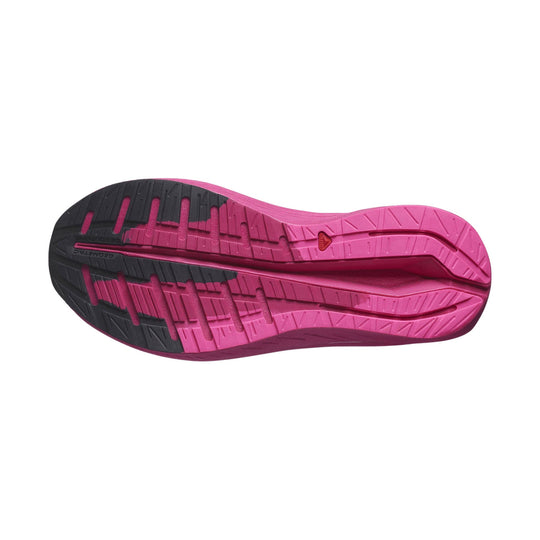 Pink and black running shoe outsole with deep traction grooves