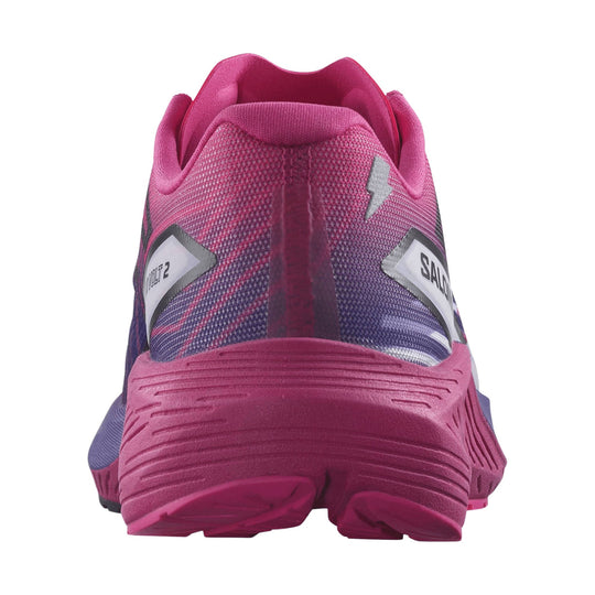 Pink and purple running shoe viewed from the back, with textured heel and logo patches