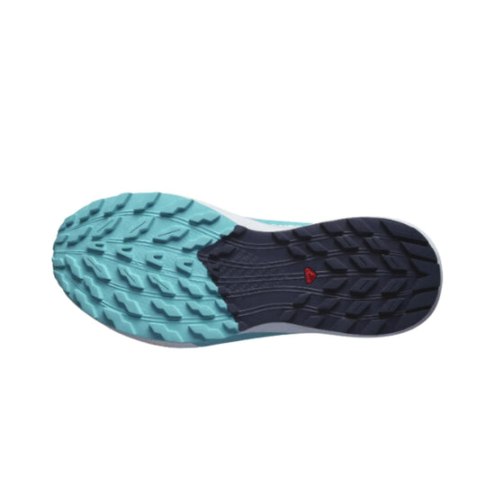 Trail running shoe outsole with teal forefoot traction and dark navy heel tread
