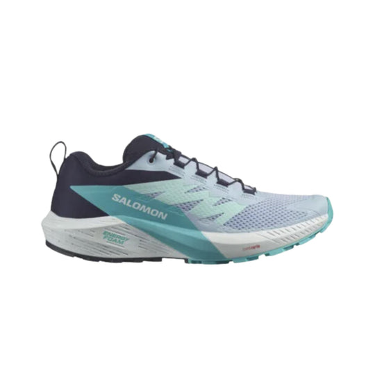 Low-cut trail running shoe in white, black, and teal with mesh upper, side logo, and pull tab