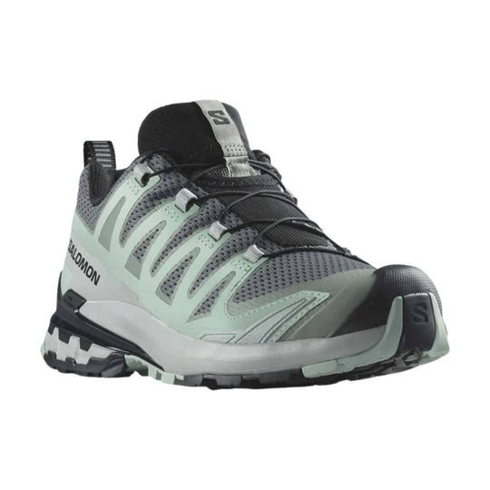 Gray and mint trail running shoe with black mesh upper, bungee laces, and toe bumper