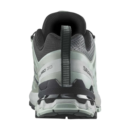 Rear view of a gray and black trail running shoe with a pull tab and rugged sole