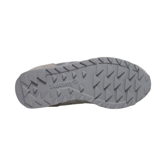 Gray sneaker sole with triangular tread and Saucony logo embossed at center