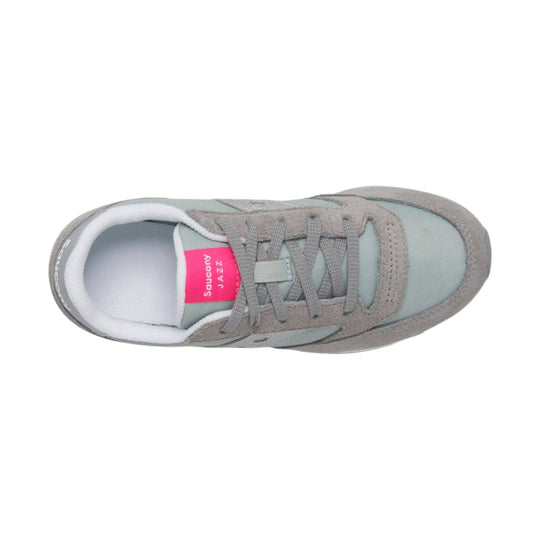 Light gray sneaker with suede overlays, gray laces, and a pink tongue label, shown from above.
