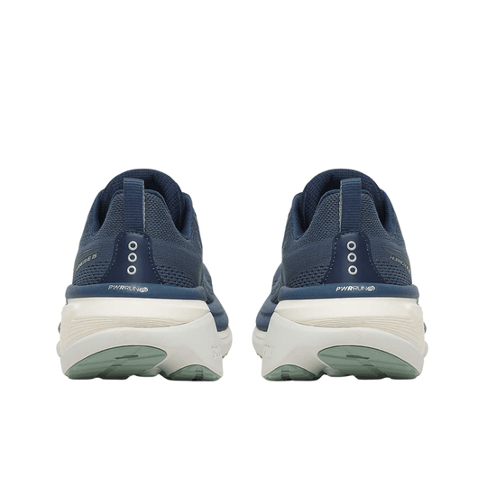 Pair of navy blue running shoes with white midsoles and green outsoles, shown from the back