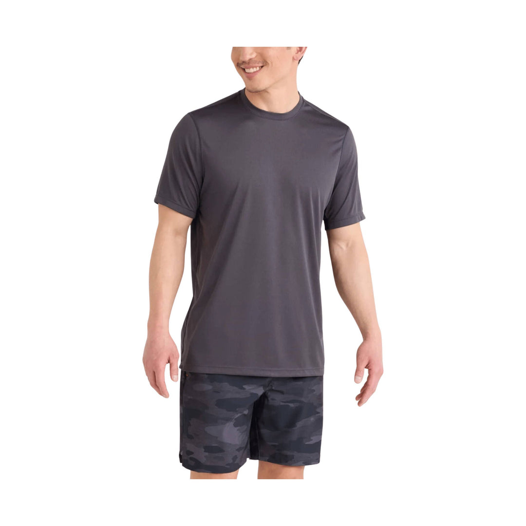 Dark gray athletic T-shirt with black camo shorts on a male model