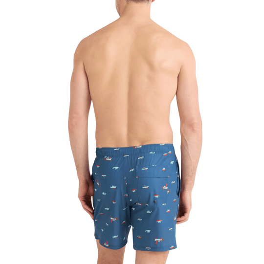 Blue swim trunks with a small multicolor boat print, back view
