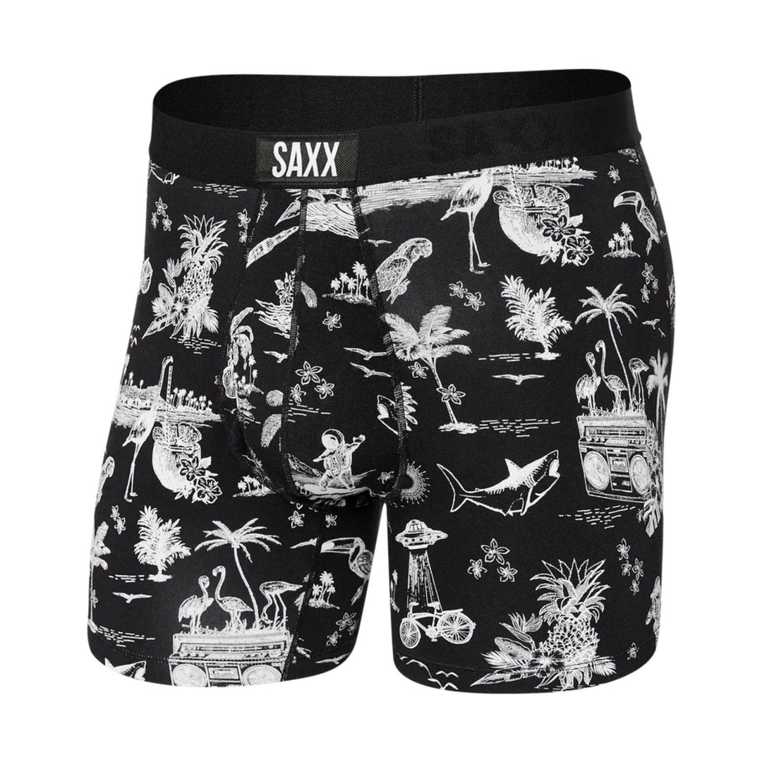 Black boxer briefs with white tropical and wildlife print and SAXX waistband logo