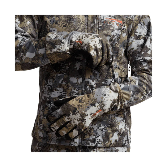 Camouflage insulated gloves worn with matching camo jacket