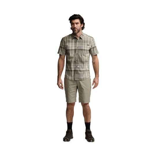 Men’s short-sleeve plaid button-up shirt with khaki shorts and hiking shoes
