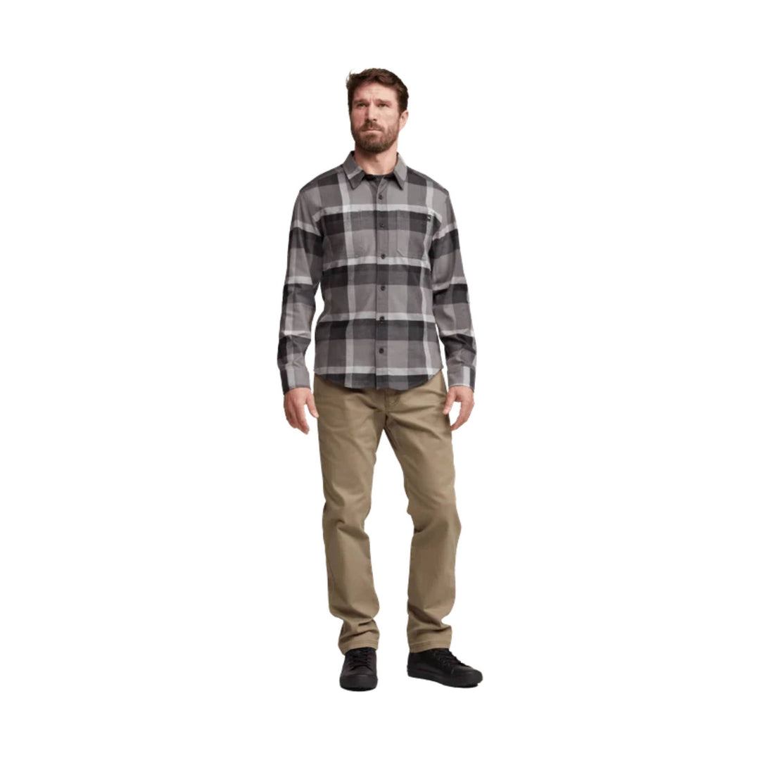 Gray plaid long-sleeve button-up shirt on a male model with khaki pants and black shoes