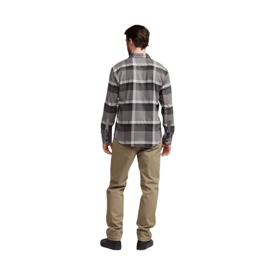 Gray plaid long-sleeve button-up shirt shown from the back with tan pants