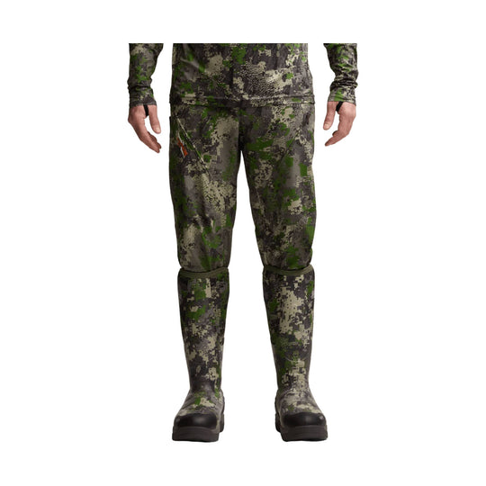 Camouflage knee-high boots worn with matching camo pants, front view