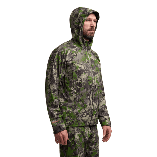Camouflage hooded zip-up jacket on a male model, shown in side view