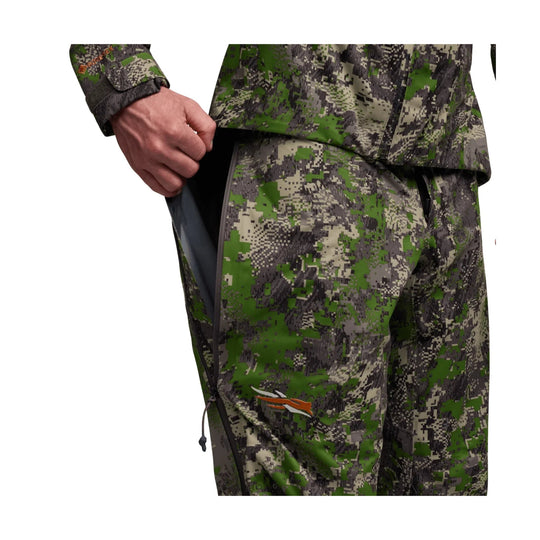 Camouflage waterproof pants with a side zipper vent and elastic drawcord