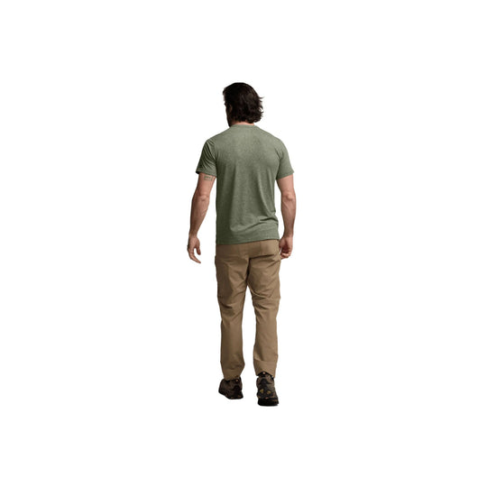 Man wearing a heathered olive short-sleeve shirt and khaki pants, shown from the back.