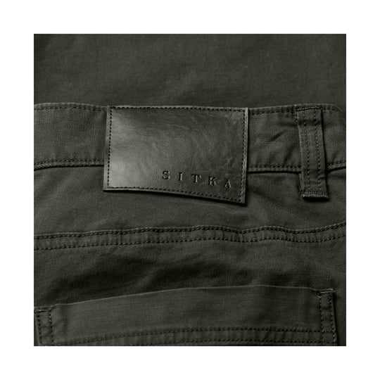 Dark pants waistband with a leather SITKA label and cargo pocket detail