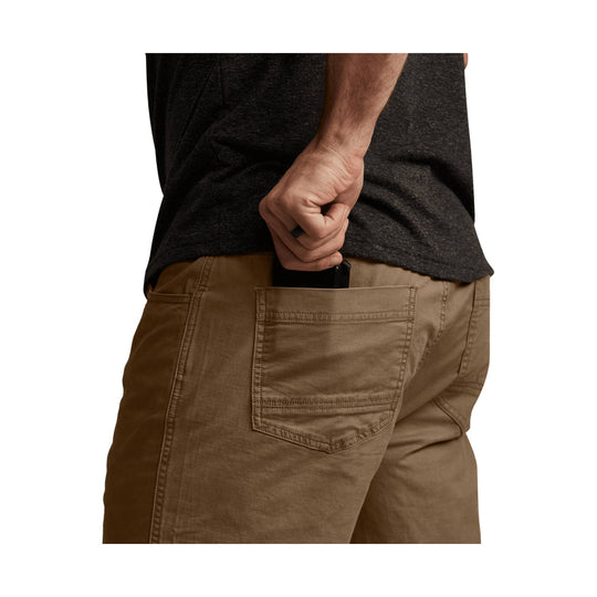 Brown work pants shown from the back with large rear patch pockets