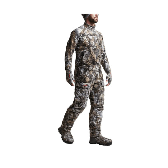 Camouflage insulated bib with zip chest pocket, cargo leg pockets, and built-in boot coverings