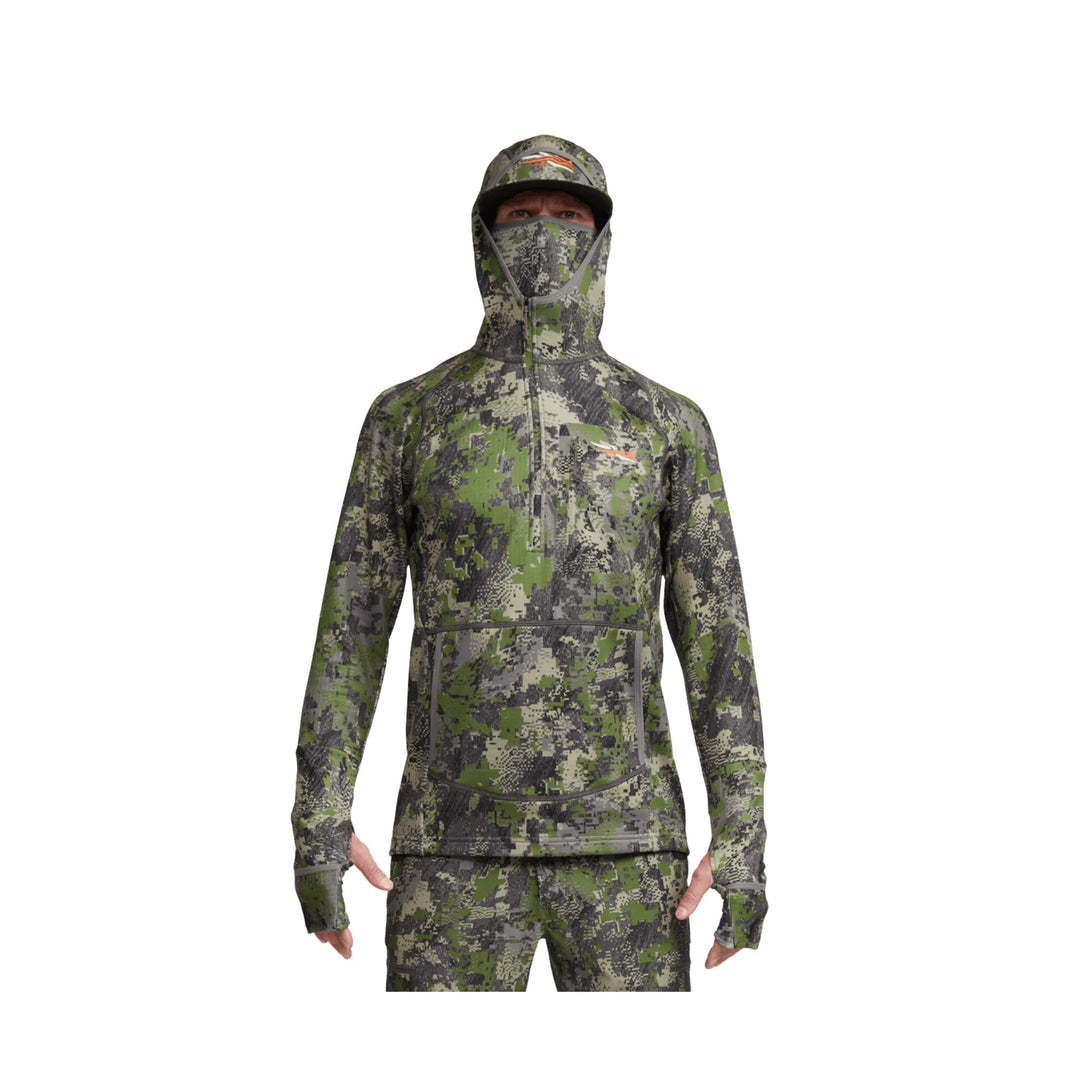 Camouflage hooded performance top with built-in face covering, zip neck, and thumbholes