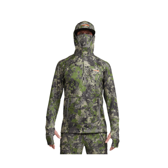 Camouflage hooded performance top with built-in face covering, zip neck, and thumbholes