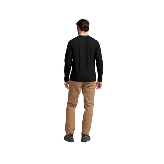 Black long-sleeve shirt shown from the back on a model