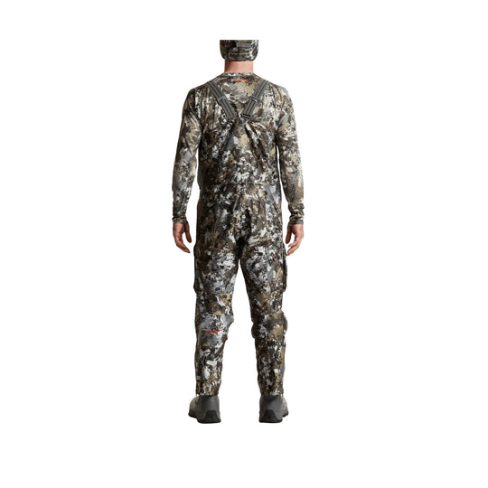 Camouflage hunting bib pants with shoulder straps, shown from the back