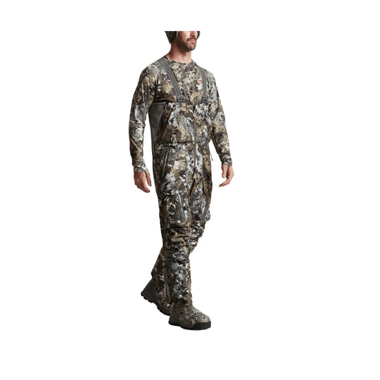 Camouflage hunting bib with suspenders, front zipper, and boot covers