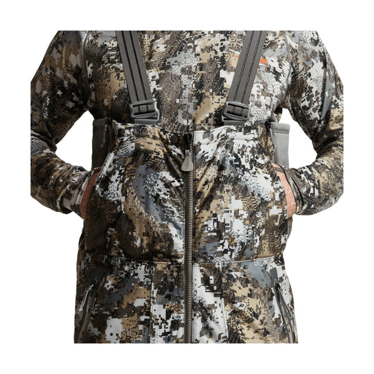 Camouflage insulated bib pants with front zipper, suspenders, and zippered hand pockets