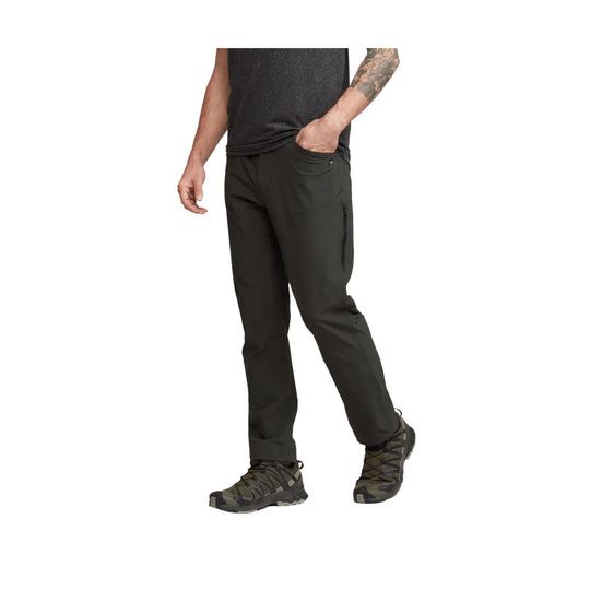 Black men's hiking pants with a zippered thigh pocket, shown with boots