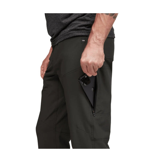 Black men’s pants with a side zip pocket holding a phone
