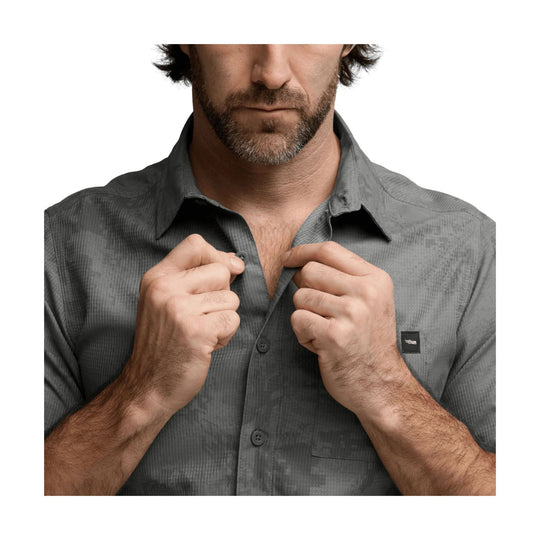 Gray short-sleeve button-up shirt with open collar and chest pocket