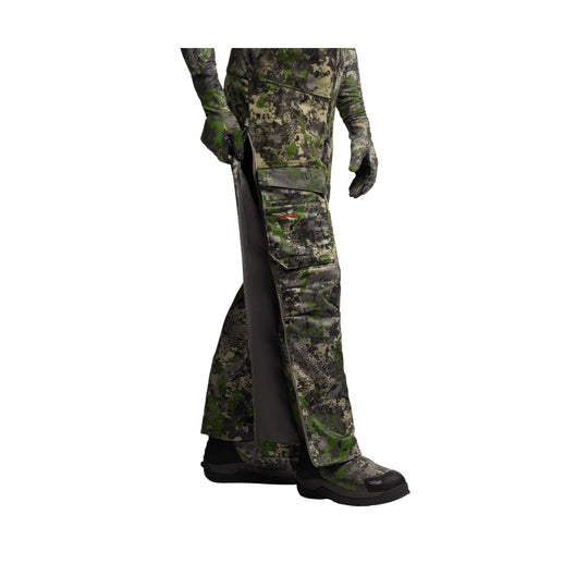 Camouflage bib pants with side zippers, cargo pockets, and black boots