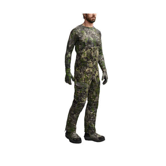 Camouflage bib overalls with integrated jacket, long sleeves, gloves, and boots on a male model