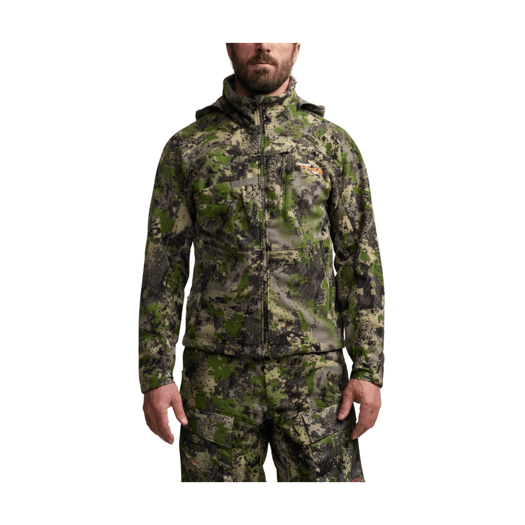Camouflage zip-front hunting jacket with chest and sleeve pockets, shown on a model
